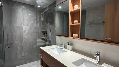 a bathroom with two sinks and a shower at 3bdr new apartmet in Laguna 50m form beasch LBS-3504 in Bang Tao Beach