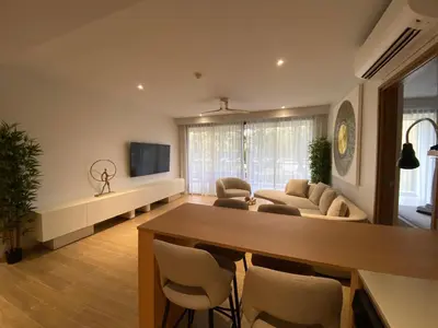 a living room with a couch and a table at 2bdr New Apartment in Laguna near Bangtao Beach LBS-4203 in Bang Tao Beach