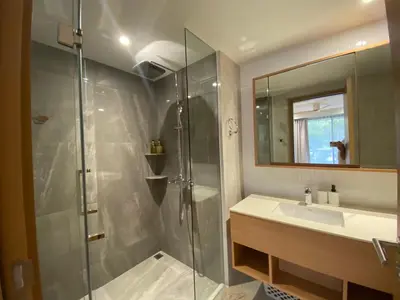 a bathroom with a shower and a sink at 2bdr New Apartment in Laguna near Bangtao Beach LBS-4203 in Bang Tao Beach