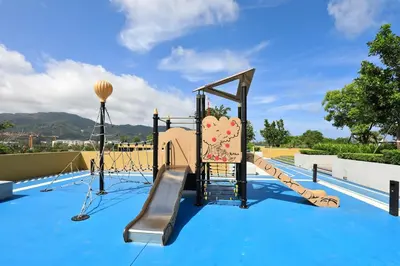 a playground with a slide on a blue surface at 2bdr New Apartment in Laguna near Bangtao Beach LBS-4203 in Bang Tao Beach