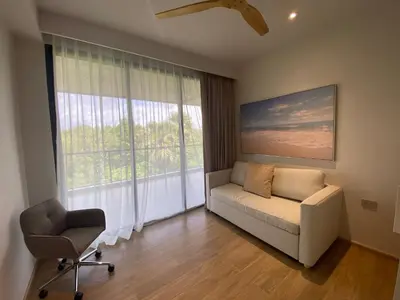 a living room with a couch and a chair and a window at 2bdr New Apartment in Laguna near Bangtao Beach LBS-4203 in Bang Tao Beach