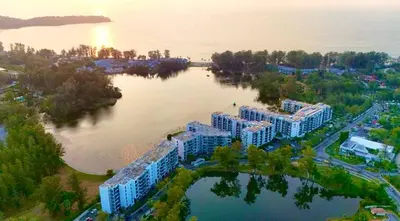an aerial view of a building on a lake at 1-bedroom apartment, Cassia Phuket in Laguna Phuket