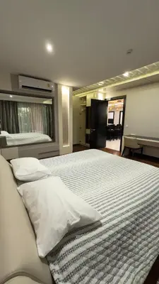 a bedroom with a large bed with white pillows at Квартира в центре Бангтао в комплексе The Regent Bangtao in Bang Tao Beach