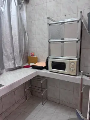 a microwave sitting on a counter in a kitchen at Hana apartment in Patong Beach