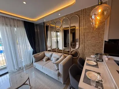 a living room with a couch and a table at New studio of Bangtao Bellevue Lagoon 213 in Laguna Phuket