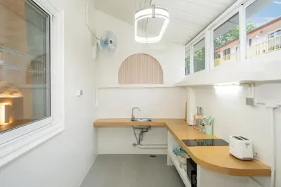 a small kitchen with a sink and a window at Stylish Studio with Pool - 8' walk to Rawai Beach - 