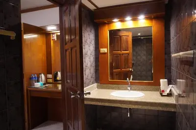 a bathroom with a sink and a mirror at Residy Downtown Hotel in Patong Beach