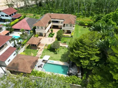 an aerial view of a house with a swimming pool at 5BR Luxury Villa Bangtao With Staff Phuket in Laguna Phuket
