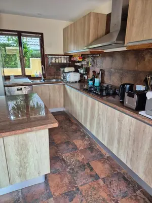 a kitchen with wooden counters and a counter top at 5BR Luxury Villa Bangtao With Staff Phuket in Laguna Phuket