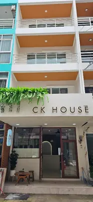 a building with a sign that reads g skill house at CK House in Patong Beach