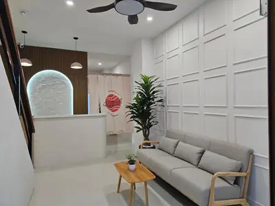 a living room with a couch and a table at CK House in Patong Beach