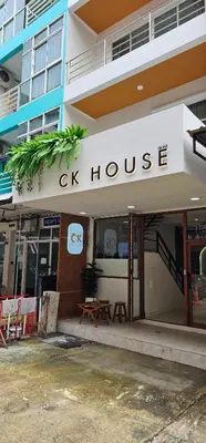 a cx house sign on the front of a building at CK House in Patong Beach