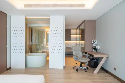 an office with a desk and a chair and a tub at Luxury 2BR Suite Lakeside Angsana Laguna in Phuket Town