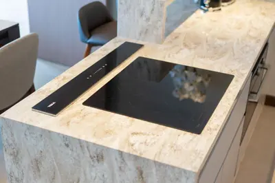 a granite counter top with a tablet on it at Luxury 2BR Suite Lakeside Angsana Laguna in Phuket Town