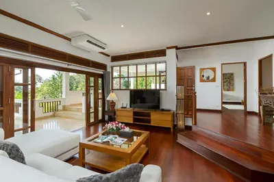 a living room with a couch and a table at 50% Off Baan Angelo 3 Bed Pool Villa Kata Hill in Kata Beach