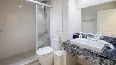 a bathroom with a sink and a shower and a toilet at PATONG TOWER Luxury Large Apartments in Patong Beach