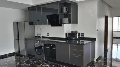 a kitchen with a washer and dryer in it at PATONG TOWER Luxury Large Apartments in Patong Beach