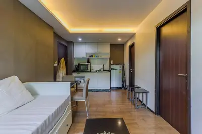 a small room with a bed and a kitchen at C239 Best Spot Beachfront 1BR Near Top Beaches in Rawai Beach