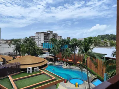 an overhead view of a swimming pool in a resort at 4 Floor - Pool view Studio room at TBHR near Kata beach in Kata Beach