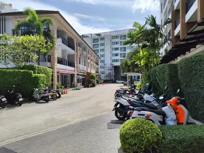 a row of motorcycles parked on the side of a street at 4 Floor - Pool view Studio room at TBHR near Kata beach in Kata Beach