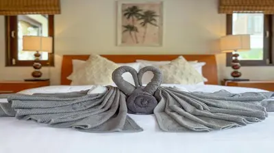 two swans towels on a bed in a bedroom at Tropical Poolside Villa - SGB4 in Phuket Town