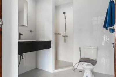 a bathroom with a toilet and a sink at Condominium Rawai D1 - near convenience beach, market, gym in Rawai Beach