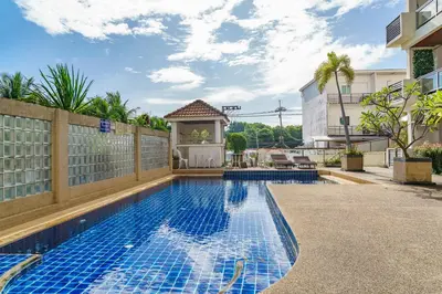 a swimming pool with a gazebo next to a house at Condominium Rawai D1 - near convenience beach, market, gym in Rawai Beach