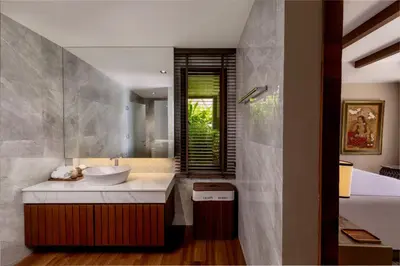 a bathroom with a sink and a tub at Villa Eugenia in Phuket Town