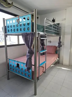 a bunk bed with a ladder and a bunk bed with a bunk bed at MT friendhome&hostel2 in Phuket Town