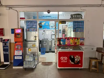 a shop with a refrigerator and a soda machine at Monkey Apartment 38 in Patong Beach