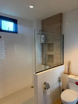 a bathroom with a shower and a toilet at Chaota Modern House in Ban Ao Makham