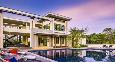 a house with a swimming pool in front of it at The Golden Palm Residence - Kathu - 10 min to Patong Beach in Kathu