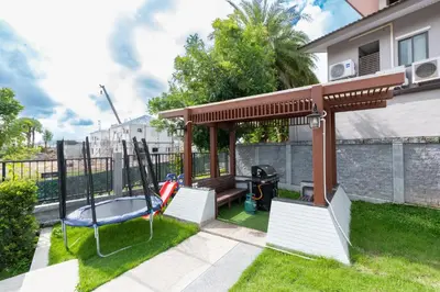a gazebo in a backyard with a swing at The Golden Palm Residence - Kathu - 10 min to Patong Beach in Kathu