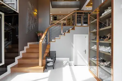 a staircase in a store with shoes on the shelves at The Golden Palm Residence - Kathu - 10 min to Patong Beach in Kathu