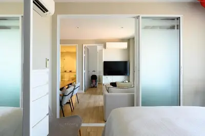 a bedroom with a view of a living room at Diamond Condominium Phuket 2BR 5 min to Bangtao beach in Bang Tao Beach