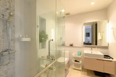 a bathroom with a shower and a sink and a toilet at Diamond Condominium Phuket 2BR 5 min to Bangtao beach in Bang Tao Beach