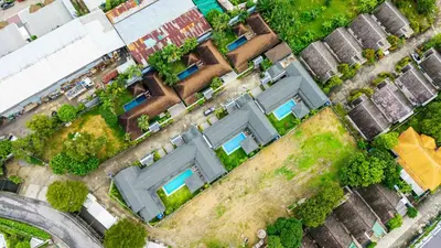 an overhead view of houses in a residential neighborhood at summer stay pool villa in Ban Na Bon
