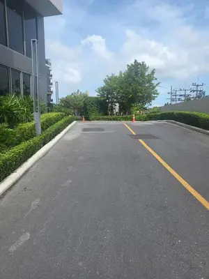 an empty road in front of a building at Sky Park Laguna F4 in Laguna Phuket