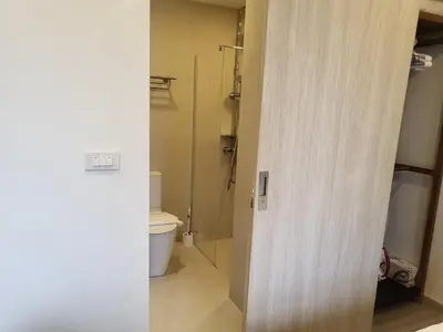 a bathroom with a toilet and a shower at Sky Park Laguna F4 in Laguna Phuket