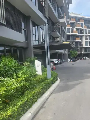 a parking lot in front of a building at Sky Park Laguna F4 in Laguna Phuket