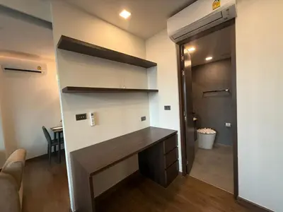 a home office with a desk in a room at New 1BR Apartment in The Proud Karon Phuket in Karon Beach