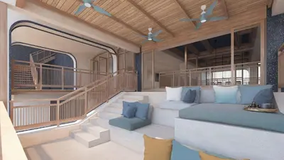 a living room with a couch and a balcony at Myneris Hotel, Phuket Karon Beach in Karon Beach
