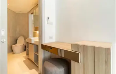 a bathroom with a desk and a sink and a toilet at Cassia 1 bedroom in Bang Tao Beach