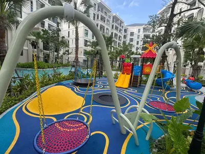 a playground with swings and a play equipment at Legendary Bang Tao in Phuket