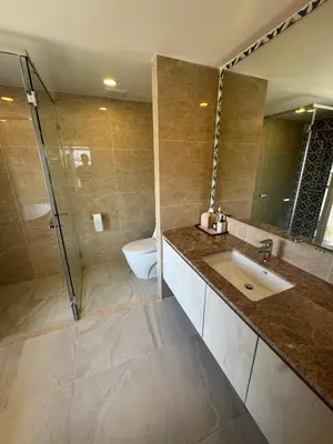 a bathroom with a sink and a shower at New luxury condo Ozone next to Laguna in Phuket