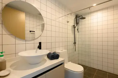 a white bathroom with a sink and a mirror at Fantasea Condo Kamala B708 1BDRM by Phuket Sabay Rent in Kamala Beach