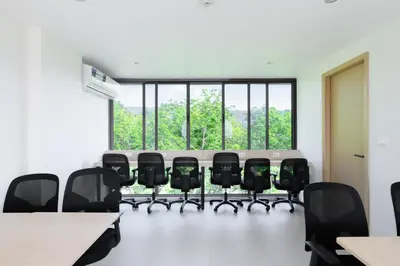 a conference room with a table and chairs at Fantasea Condo Kamala B708 1BDRM by Phuket Sabay Rent in Kamala Beach