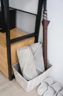 a basket of towels sitting on a shelf at A&J Holiday Villa in Ban Na Bon