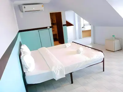 a hospital room with a bed and a staircase at xx Mitr Inn - Phuket Old Town มิตรอินน์ ภูเก็ต เมืองเก่า 3 in Phuket Town