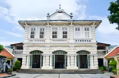 an old white building in a street at xx Mitr Inn - Phuket Old Town มิตรอินน์ ภูเก็ต เมืองเก่า 3 in Phuket Town